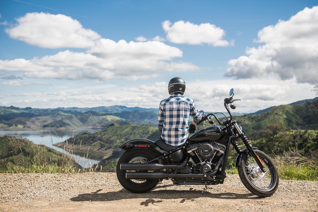 A person sitting on their motorcycle overlooking the valley.