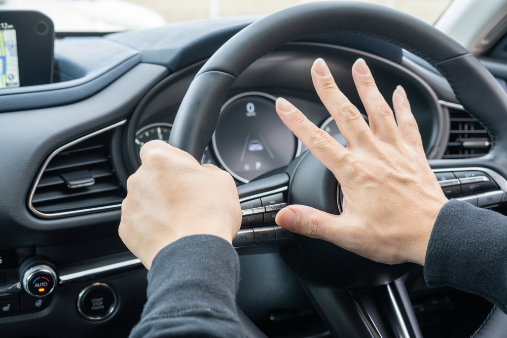 Lawyer highlights “willful or wanton disregard” in legal book while explaining reckless driving case.
