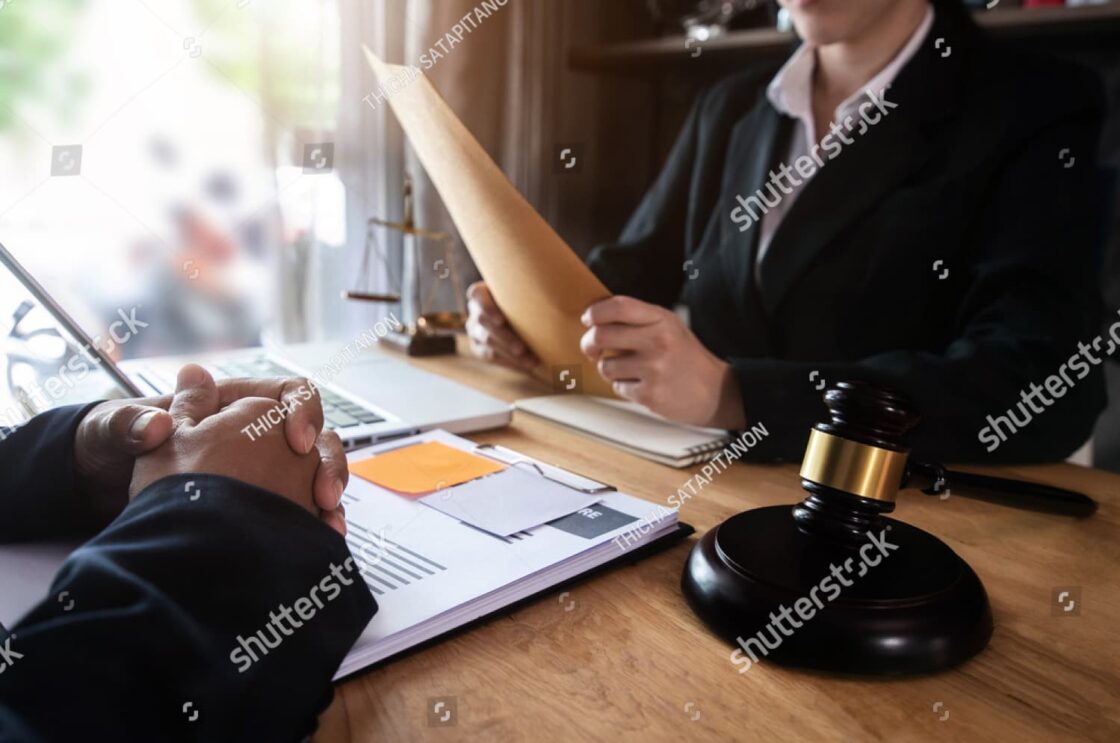 Lawyers in a meeting at a law office, discussing case strategy—showing when legal help becomes necessary.
